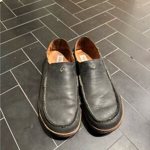 OluKai Black Slip-On Leather Loafers with Brown Sole Trim